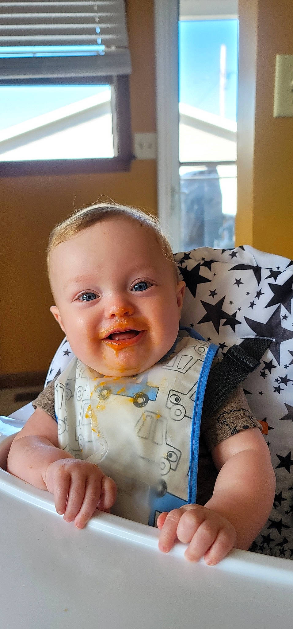 T.j is registered to the contest to win money with this photo: baby, baby_products, baby_toddler_clothing, cheek, child, chin, comfort, computer, facial_expression, fun, happy, joy, laptop, mouth, person, room, sitting, skin, sleeve, smile