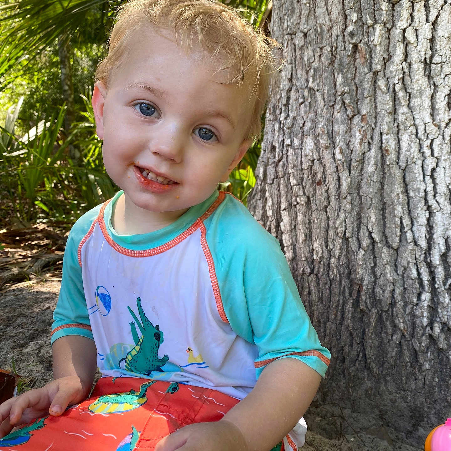 Malcolm joined the competition — help win amazing prizes! baby, ball, clothing, face, football, grass, head, outdoors, person, photography, plant, portrait, sitting, soccer, soccerball, sport, summer, t_shirt, tree, vegetation