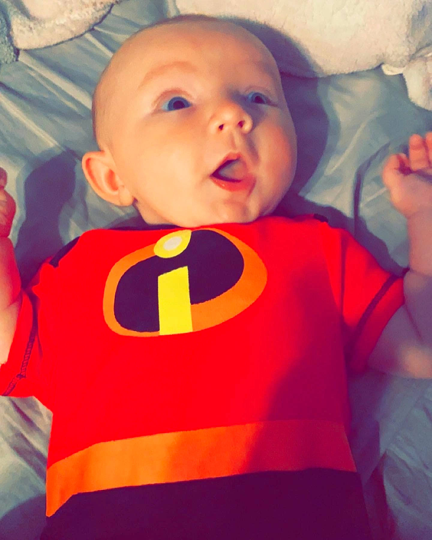 Marceline joined the competition — help win amazing prizes! baby, baby_toddler_clothing, cool, face, finger, gesture, happy, head, mouth, muscle, nose, orange, organ, outerwear, person, shirt, sleeve, standing, t_shirt, textile