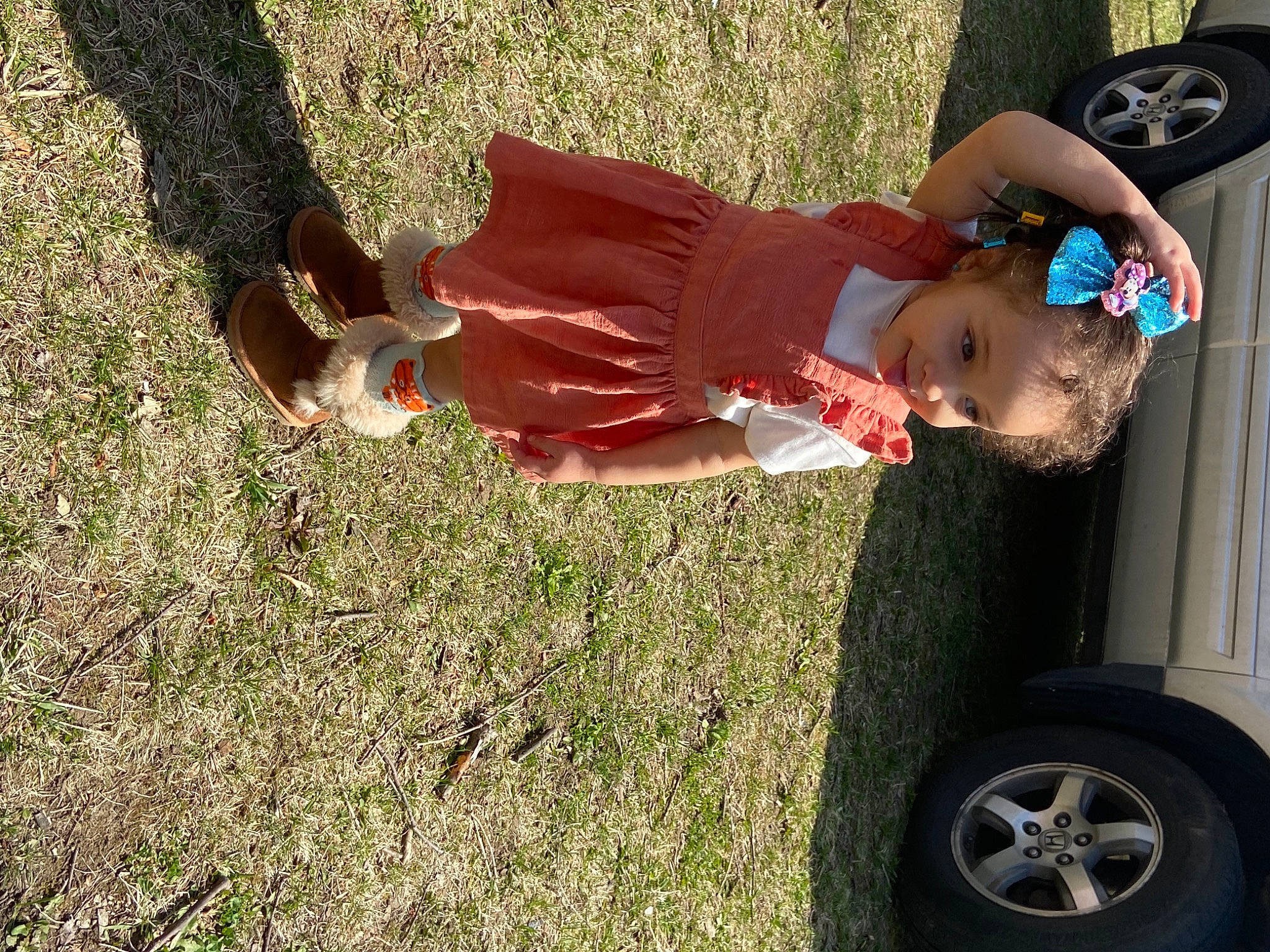 Danielle is registered to the contest to win money with this photo: automotive_exterior, automotive_tire, baby, baby_toddler_clothing, bumper, car, fender, fun, grass, happy, hat, leg, people_in_nature, person, plant, tire, toddler, tree, vehicle, vehicle_door