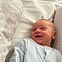 Noah joined the competition — help win amazing prizes! baby, newborn, smile, onesie, bed, pillow, butterfly, soft, cozy, infant, sleepwear, child, cute, happy, lying_down, person, face, skin, head, comfort