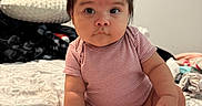 Araceli is registered to the contest to win money with this photo: baby, bed, blanket, casual, child, curious, cute, expression, face, furniture, hair_clip, indoors, infant, person, pillow, room, sitting, skin, soft_lighting, striped_clothing