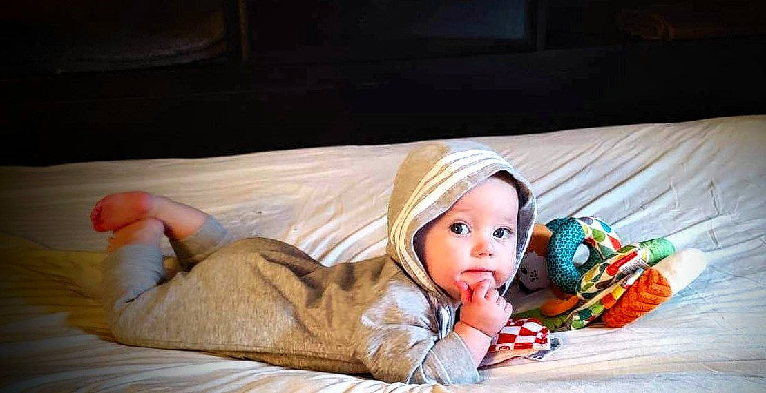 Matthew is registered to the contest to win money with this photo: baby, baby_toddler_clothing, bed, bedding, bedtime, child, comfort, couch, flash_photography, flooring, fur, headwear, leisure, linens, nap, person, portrait_photography, room, sitting, textile