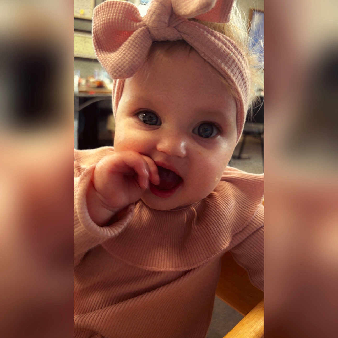 Brynleigh is registered to the contest to win money with this photo: baby, child, infant, face, headband, bow, pink, clothing, cute, portrait, hand, mouth, eyes, indoor, person, soft_lighting, closeup, expression, fingertips, adorable