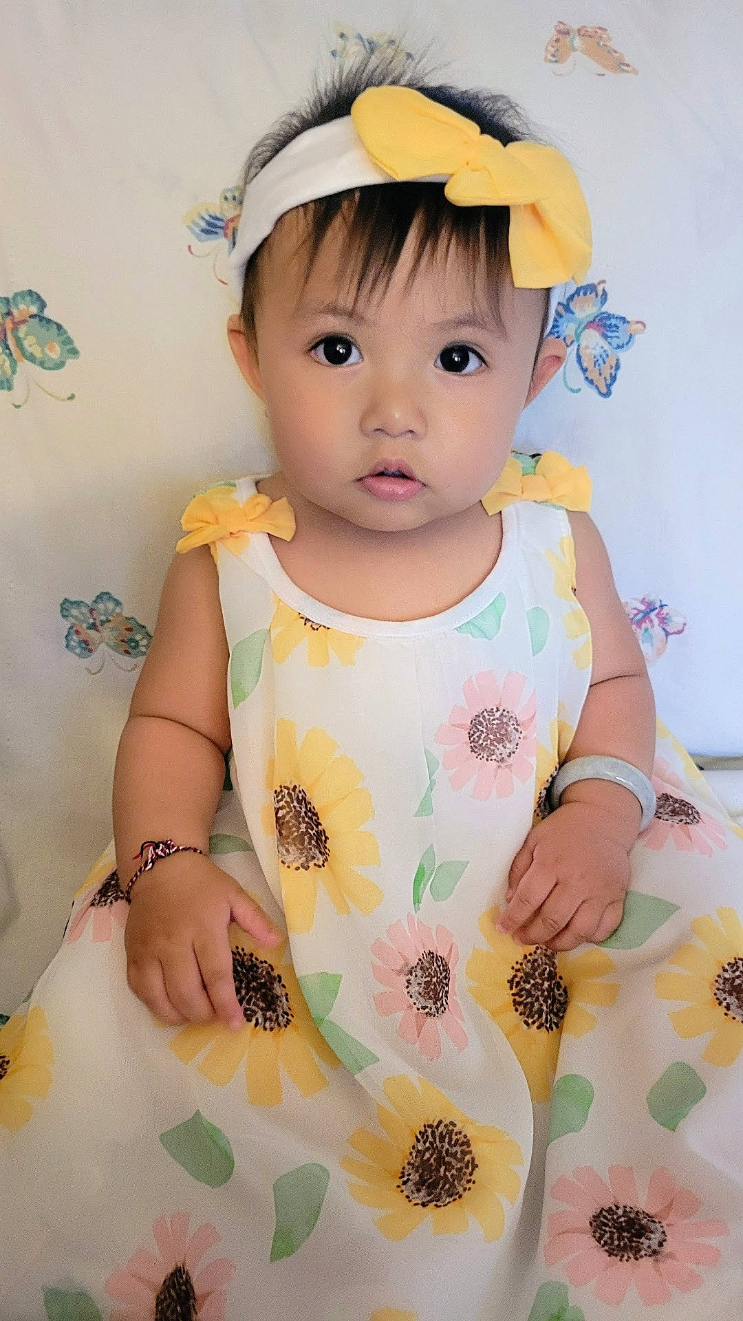 Sabrina is registered to the contest to win money with this photo: accessories, baby, bodypart, bracelet, clothing, couch, dress, face, finger, formalwear, furniture, hand, head, headband, homedecor, jewelry, necklace, person, photography, portrait