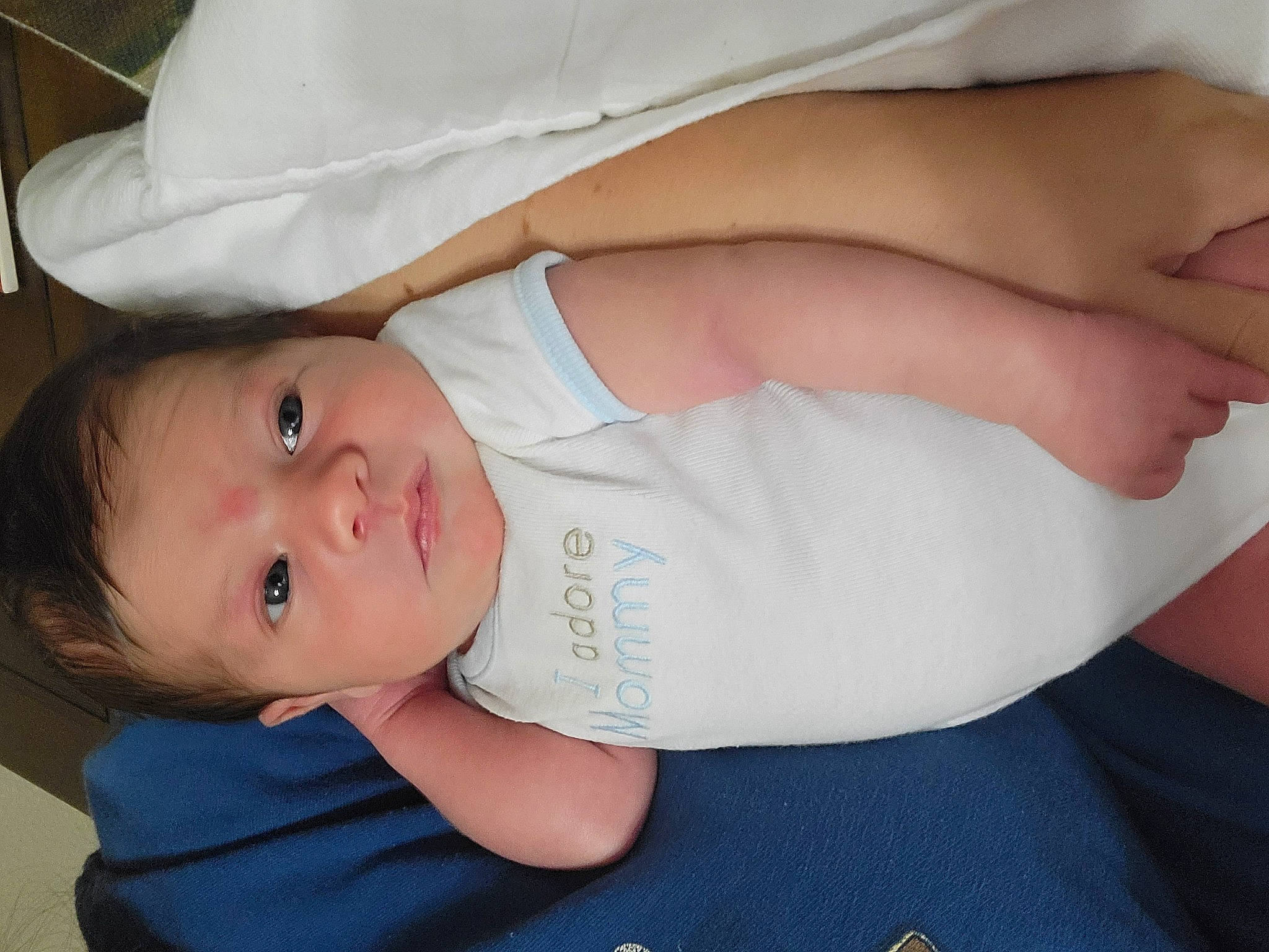 Aiden is registered to the contest to win money with this photo: baby, baby_products, baby_toddler_clothing, cheek, clothing, comfort, elbow, eye, finger, gesture, hat, headgear, human_body, lip, nail, pattern, person, skin, sleeve, thumb