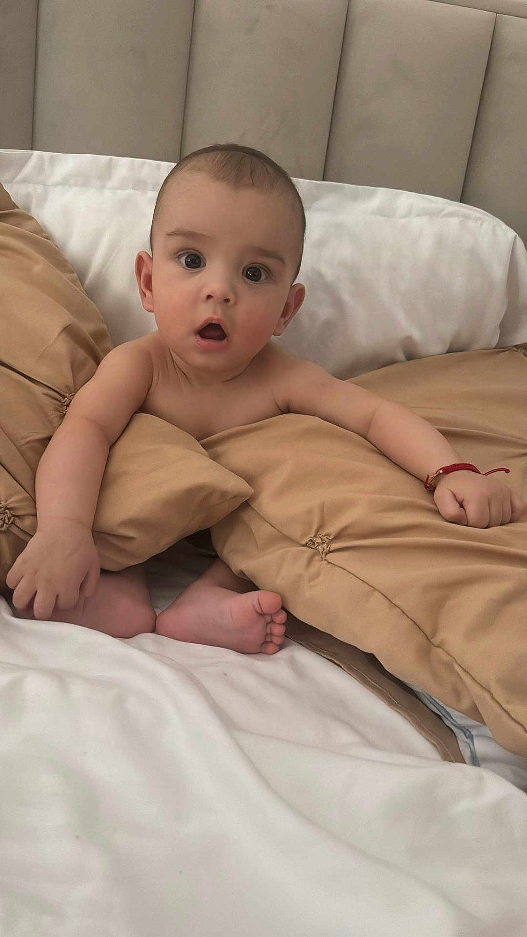 Sian joined the competition — help win amazing prizes! baby, infant, bed, pillow, blanket, skin, expression, surprised, bracelet, foot, hand, indoors, headboard, cute, child, sleepwear, resting, comfort, soft, young
