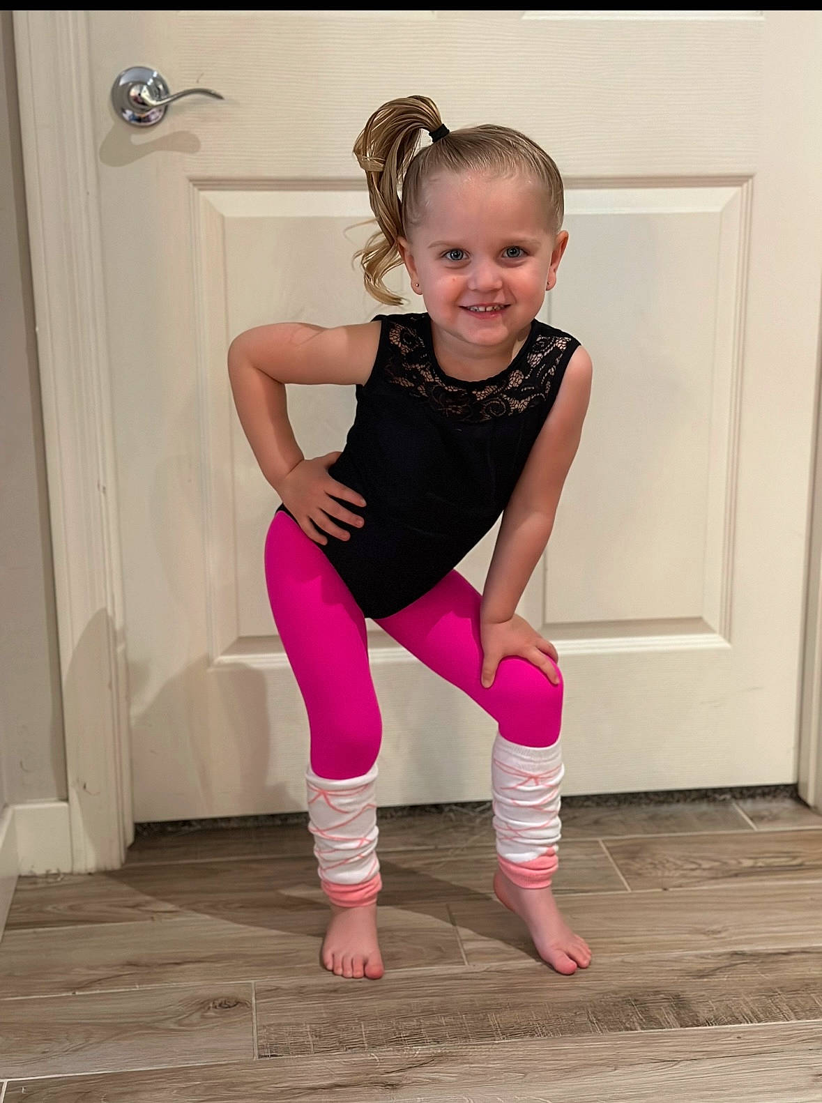 Payson is registered to the contest to win money with this photo: baby_toddler_clothing, barefoot, dance, floor, flooring, happy, hardwood, human_leg, joy, knee, leg, magenta, performing_arts, person, pink, sleeve, smile, sock, sportswear, thigh