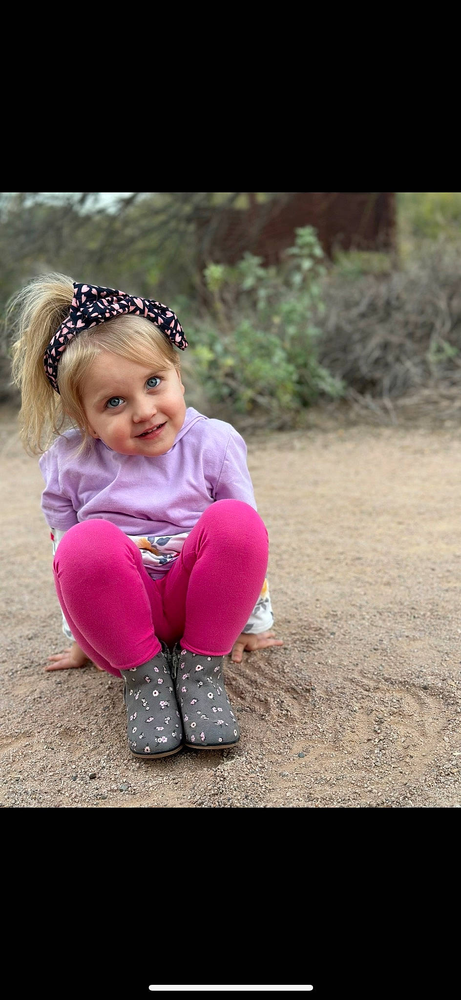 Payson is registered to the contest to win money with this photo: baby_toddler_clothing, dress, fashion_accessory, flash_photography, footwear, grass, happy, headband, headpiece, human_body, jewellery, joy, leg, magenta, people_in_nature, person, pink, plant, recreation, sitting