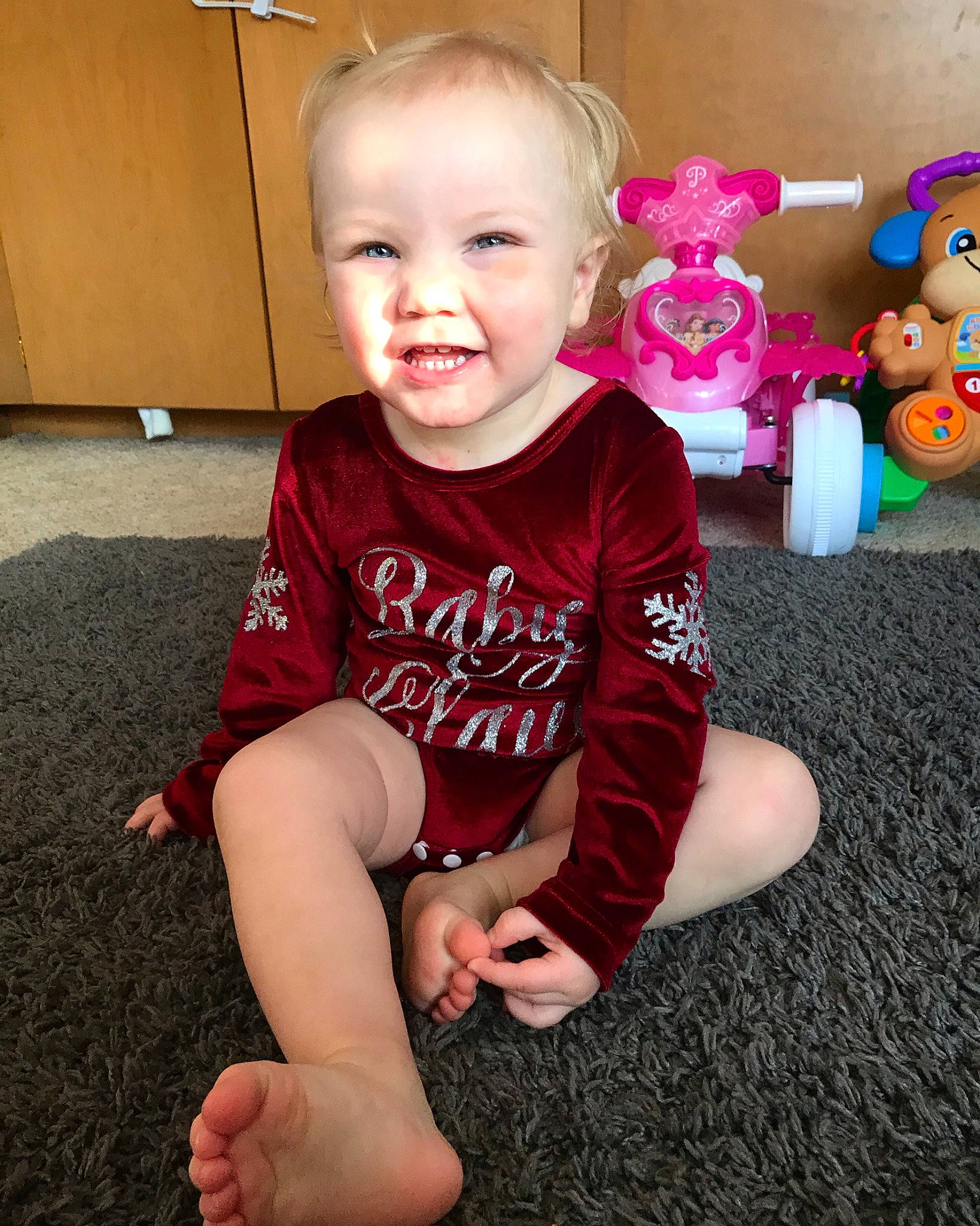 Calista is registered to the contest to win money with this photo: ankle, baby, baby_products, baby_toddler_clothing, baby_toys, barefoot, child, finger, foot, joy, lap, laugh, mouth, person, plush, sock, stuffed_toy, teddy_bear, thumb, toddler