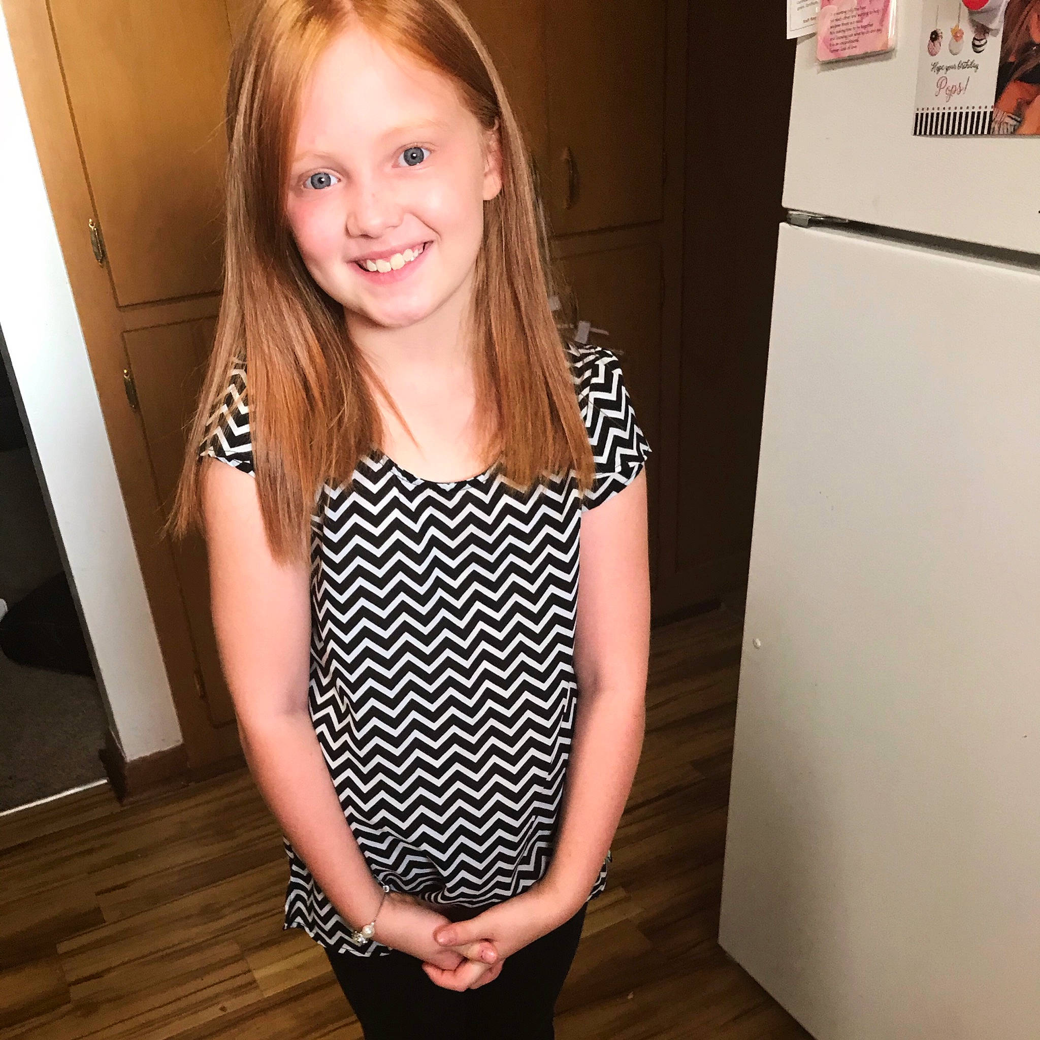 Emma is registered to the contest to win money with this photo: baby_toddler_clothing, blond, brown_hair, child_model, day_dress, facial_expression, joy, laminate_flooring, laugh, long_hair, person, picture_frame, polka_dot, shoulder, sleeve, tooth, top, waist