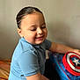 Mylann participe au concours pour gagner de l'argent avec cette photo : child, smiling, blue_shirt, backpack, captain_america, indoor, short_sleeves, happy, seated, boy, young_child, casual_clothing, hair, toy, colorful, portrait, face, person, closeup, light