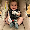 Zayne joined the competition — help win amazing prizes! baby, car_seat, maxi_cosi, infant, smiling, mittens, socks, seat_belt, child, happy, indoor, person, cute, comfortable, safety, clothing, head, face, strapped, wood_floor