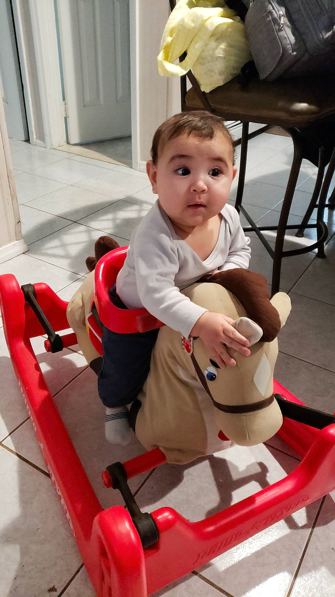 Landyn is registered to the contest to win money with this photo: baby_carriage, baby_products, car_seat, chair, child, day, fun, furniture, infant, leg, person, play, product, red, sitting, skin, surprise, toddler