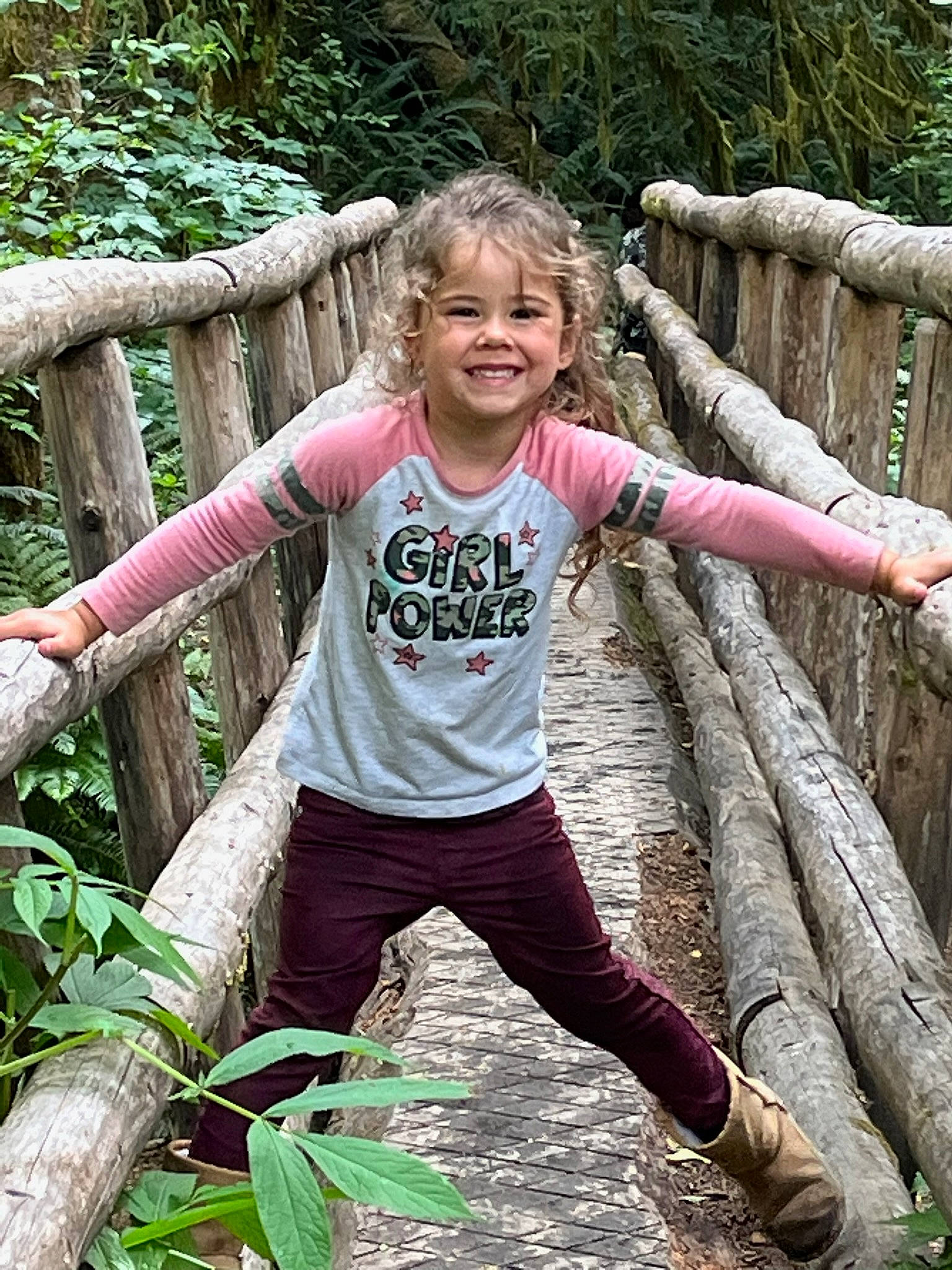 Maia is registered to the contest to win money with this photo: botany, forest, fun, grass, happy, joy, jungle, leg, leisure, mammal, natural_environment, nature, people_in_nature, person, plant, recreation, smile, terrestrial_plant, trunk, vertebrate