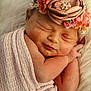 newborn, baby, sleeping, flower_crown, blanket, wrapped, infant, cute, soft_texture, peaceful, portrait, closeup, skin, headband, pink, resting, tiny_hands, cozy, face, child
