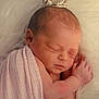 Reina is registered to the contest to win money with this photo: newborn, baby, sleeping, crown, blanket, pink, soft, infant, cute, portrait, closeup, peaceful, resting, skin, hand, head, face, fuzzy, cozy, wrapped