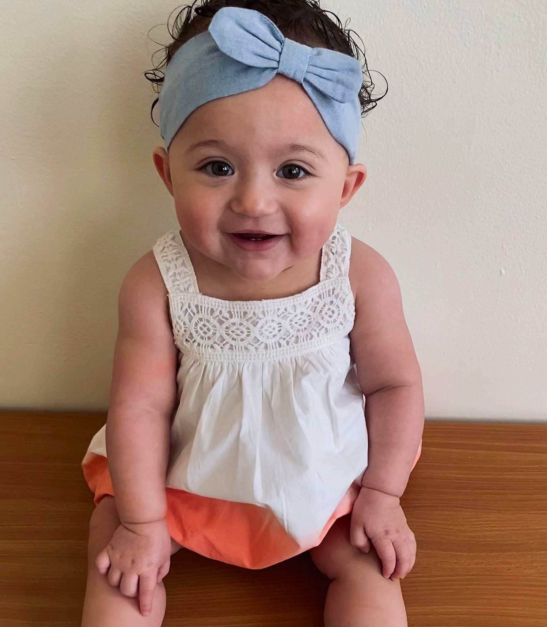 Ava Nichole is registered to the contest to win money with this photo: baby, baby_toddler_clothing, cap, face, goggles, hair_accessory, happy, head, headgear, headpiece, headwear, human_leg, iris, joy, knee, person, pink, sleeve, smile, thigh