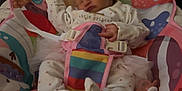 Liara Rae-Leigh joined the competition — help win amazing prizes! newborn, baby, sleeping, pajamas, baby_seat, blanket, pacifier, colorful, patterned, indoors, infant, child, cute, resting, soft_toys, fabric, comfort, safety_belt, home, peaceful