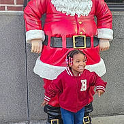 Na'Lani is registered to the contest to win money with this photo: child, city, clothing, coat, costume, face, female, festival, footwear, girl, head, jacket, jeans, pants, person, photography, portrait, road, shoe, street