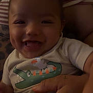 Frankie joined the competition — help win amazing prizes! baby, bird, cartoon, child, closeup, clothing, crocodile, cute, dimples, face, hand, happy, holding, indoors, infant, person, portrait, shirt, smile, tongue