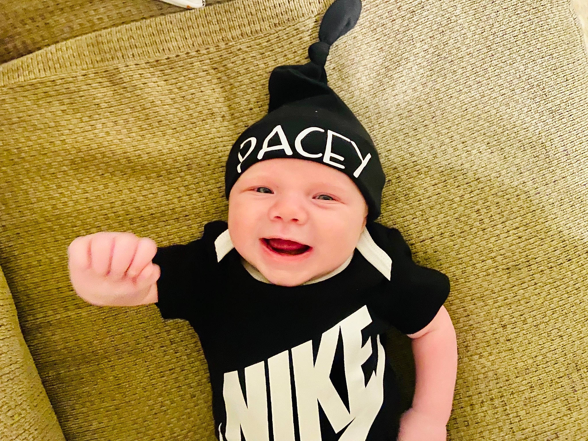 Pacey is registered to the contest to win money with this photo: baby, baby_toddler_clothing, beanie, cap, costume, costume_accessory, costume_hat, event, fashion_accessory, font, fun, happy, headwear, human_body, outerwear, pattern, person, room, sleeve, smile