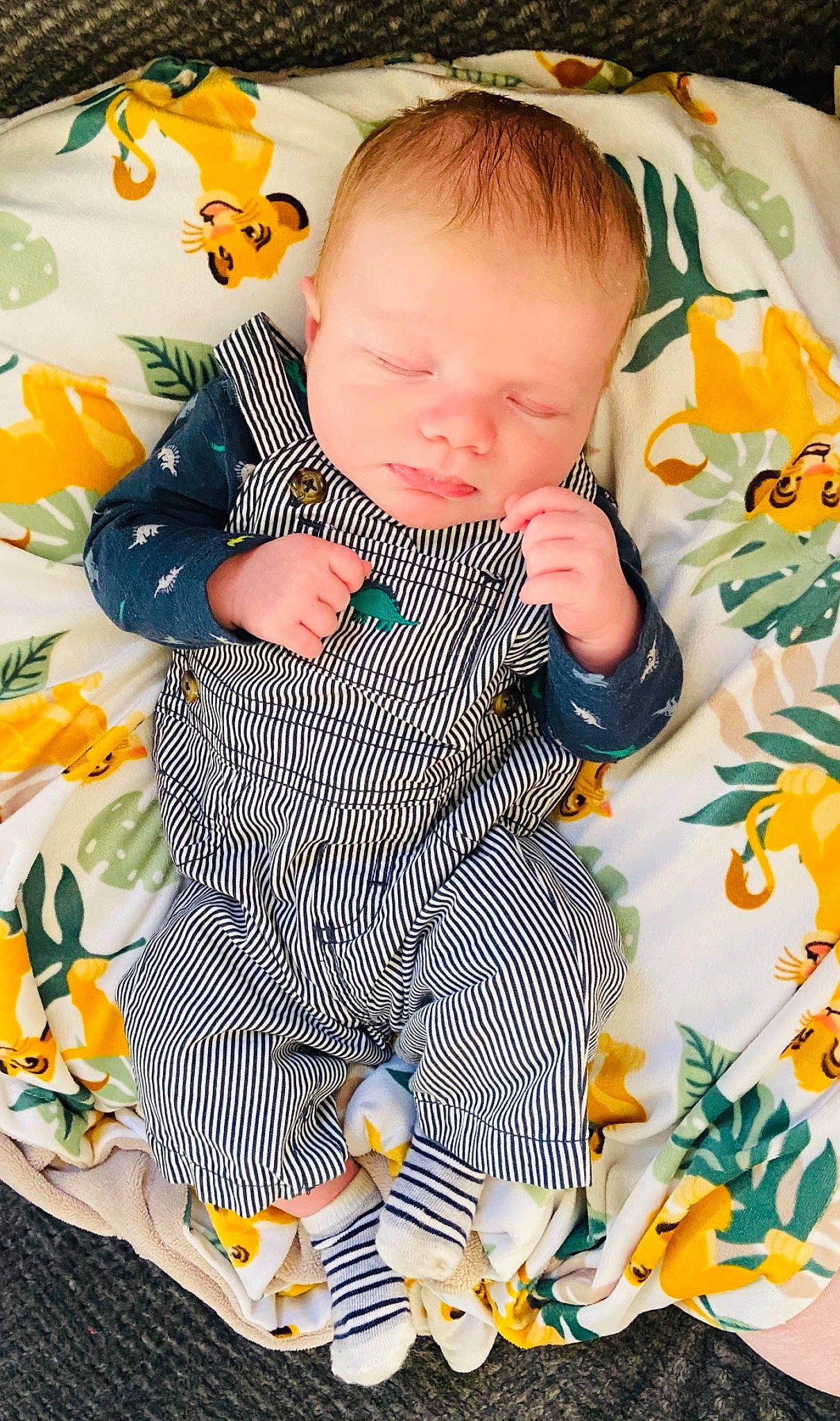 Pacey is registered to the contest to win money with this photo: baby, baby_products, baby_safety, baby_sleeping, baby_toddler_clothing, cheek, child, comfort, grass, green, head, linens, pattern, person, product, sitting, sleeve, textile, toddler, white