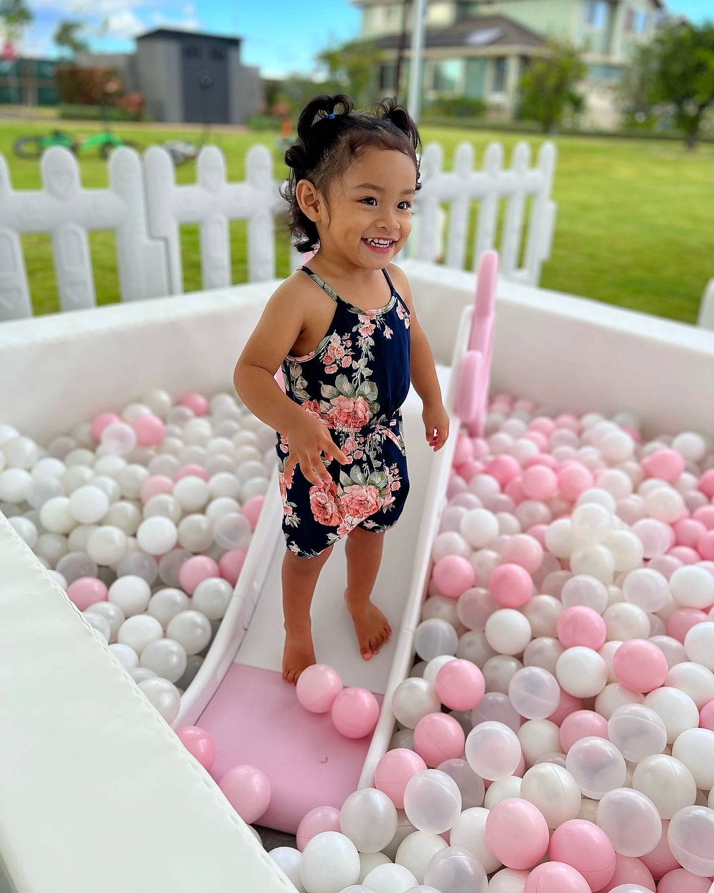 Kyla is registered to the contest to win money with this photo: child, clothing, event, fun, happy, joy, leisure, magenta, pattern, person, pink, plant, play, portrait_photography, recreation, sky, smile, sweetness, toddler, vacation