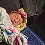 Joanna joined the competition — help win amazing prizes! baby, sleeping, blanket, bow, headband, pillow, couch, laptop, keyboard, cozy, indoor, resting, infant, soft, peaceful, child, person, technology, comfort, home