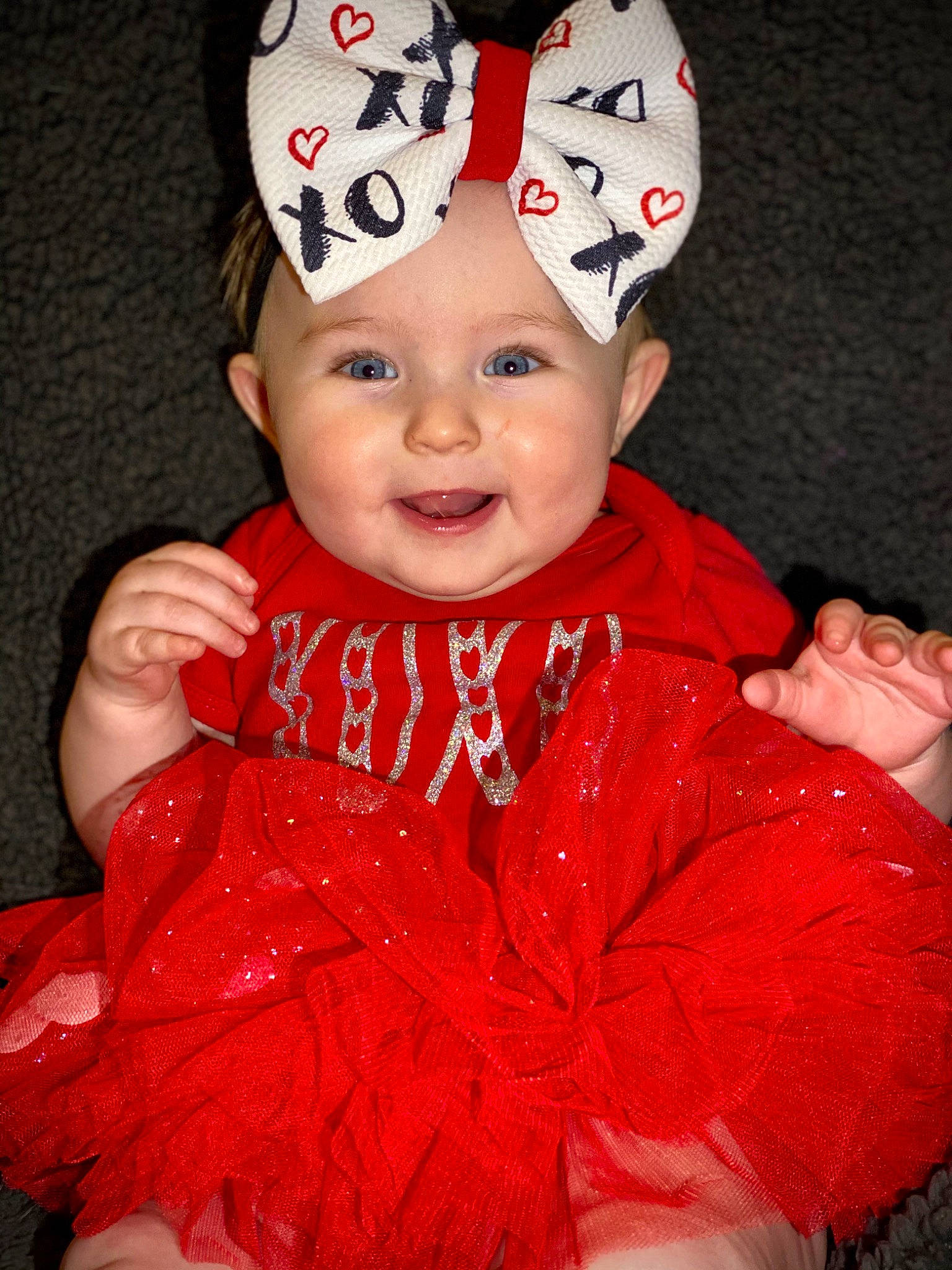 Maisyn is registered to the contest to win money with this photo: baby, baby_toddler_clothing, baseball_cap, cap, carmine, costume_hat, event, fashion_accessory, hair_accessory, happy, headwear, human_body, magenta, outerwear, person, pink, red, sleeve, smile, toddler