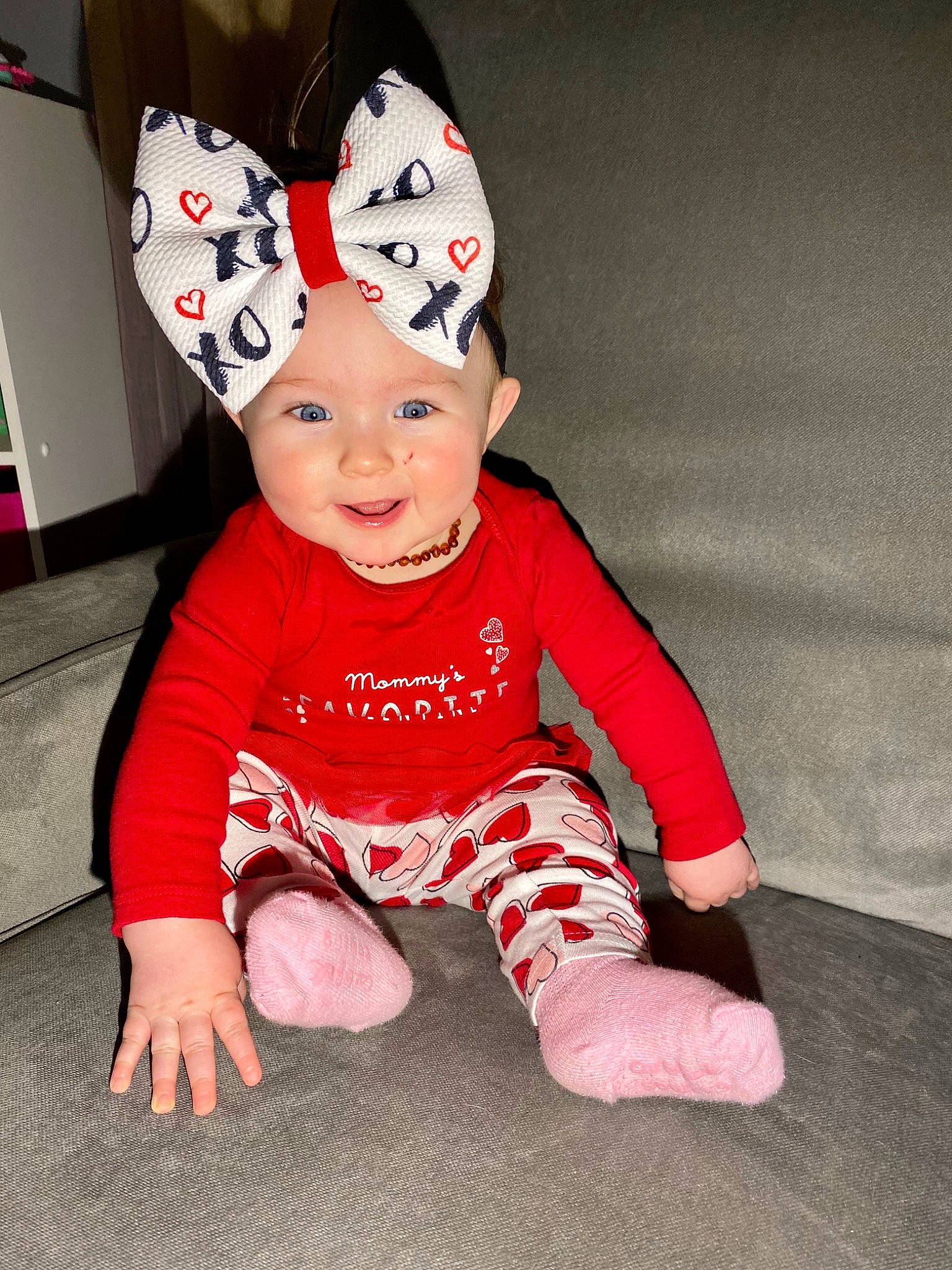 Maisyn is registered to the contest to win money with this photo: baby, baby_toddler_clothing, cap, carmine, child, costume_hat, eye, face, fashion_accessory, flooring, fun, happy, head, headgear, headwear, human_body, magenta, person, pink, sleeve