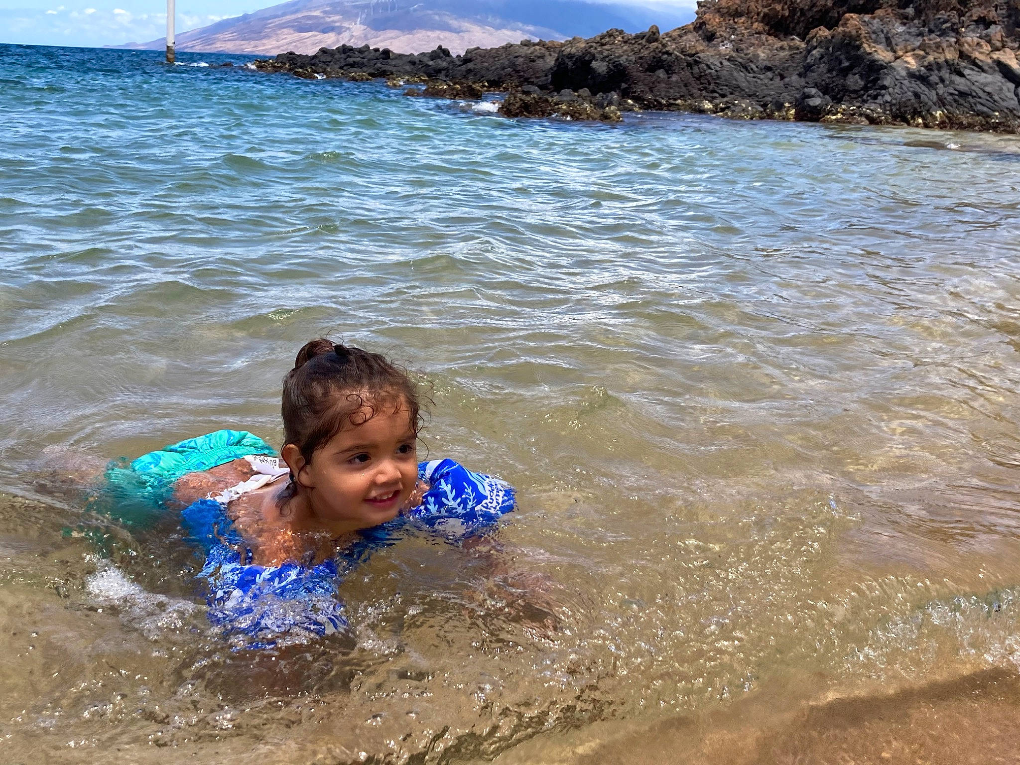 Makaio joined the competition — help win amazing prizes! beach, child, coastal_and_oceanic_landforms, face, fun, happy, lake, leisure, nature, people_on_beach, person, recreation, sand, sky, smile, summer, toddler, travel, water, water_resources