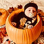 Jaxson joined the competition — help win amazing prizes! baby, pumpkin, halloween, pacifier, autumn_leaves, candy, costume, infant, orange, black_clothing, headwear, holiday, seasonal, cute, child, indoors, decor, festive, celebration, portrait