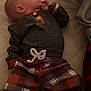Jaxson joined the competition — help win amazing prizes! baby, infant, child, plaid_pants, dark_top, lying_down, bed, blanket, soft_surface, hand_near_mouth, side_view, indoors, cute_outfit, cozy, resting, small_face, young, portrait, sleepwear, comfortable