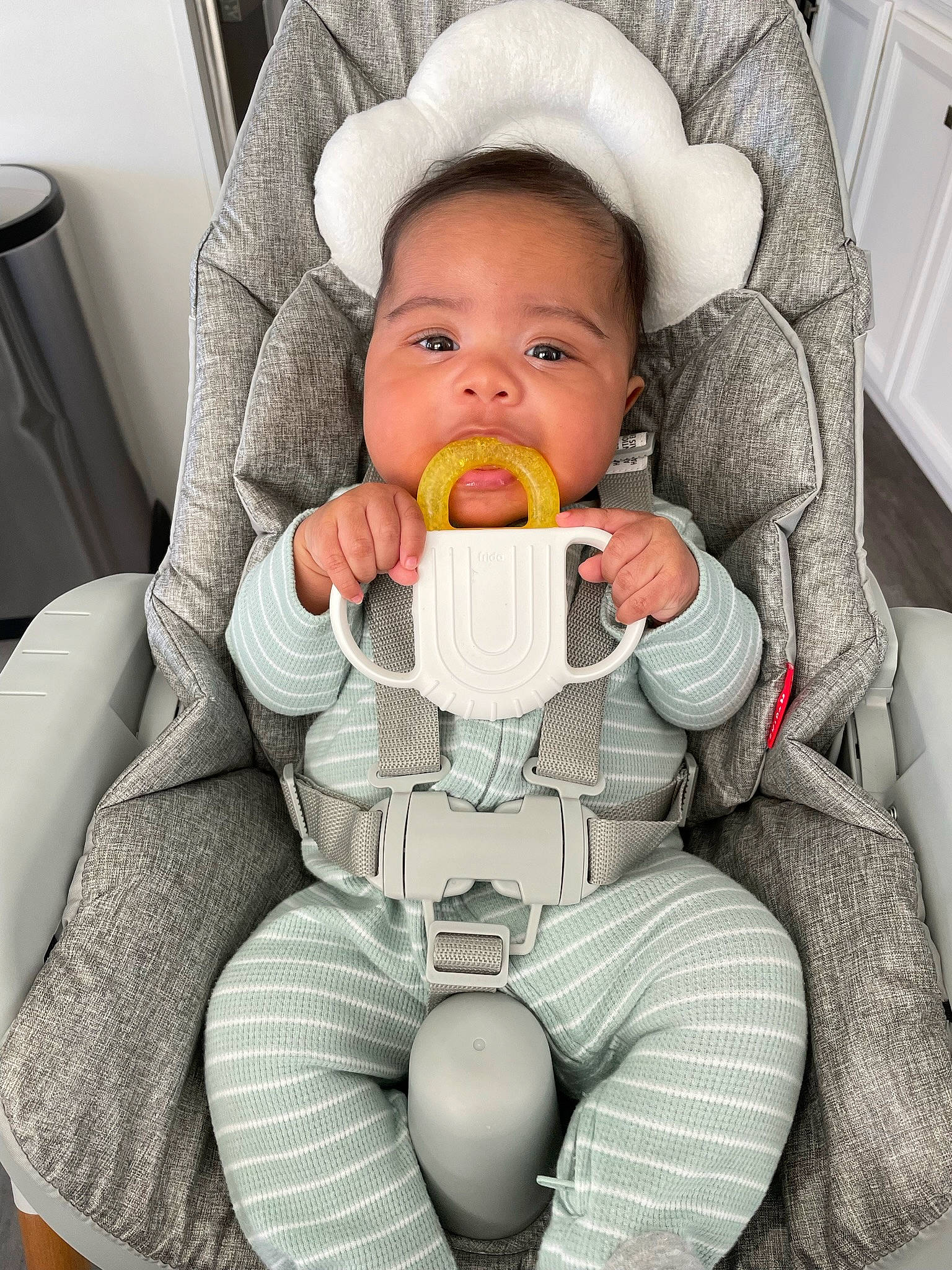 Saint is registered to the contest to win money with this photo: baby, baby_carriage, baby_products, baby_toddler_clothing, balloon, car_seat, cheek, child, comfort, eye, fun, happy, head, mouth, organ, person, seat_belt, sitting, skin, toddler