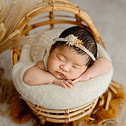 Misum Rai joined the competition — help win amazing prizes! baby, sleeping, headband, flower, wicker_chair, knitted_wrap, infant, peaceful, closeup, portrait, soft_light, dried_plants, boho_style, cozy, newborn, cute, resting, indoor, warm_colors, decor