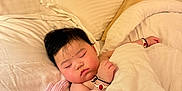Misum Rai joined the competition — help win amazing prizes! baby, sleeping, blanket, bed, pillow, plush_toy, stuffed_animal, indoor, child, rest, cute, peaceful, soft, comfort, warm, person, face, hair, wristband, relaxation