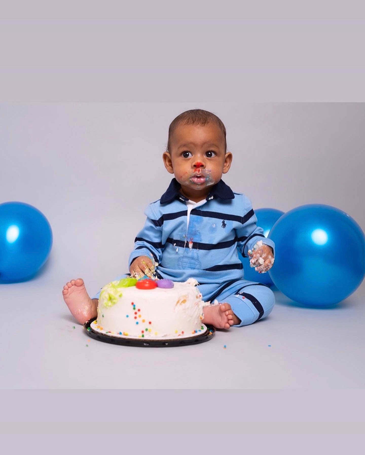 Dailan joined the competition — help win amazing prizes! baby, baby_toddler_clothing, balloon, birthday_cake, cake, cake_decorating_supply, child, dessert, electric_blue, event, face, fun, happy, party_supply, person, sitting, sleeve, sugar_cake, t_shirt, table