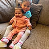 Xyena is registered to the contest to win money with this photo: children, siblings, baby, toddler, girl, sisters, smiling, portrait, indoors, couch, sofa, sitting, baby_clothing, pink_outfit, blue_shirt, hair_bows, braids, white_shoes, family, cozy