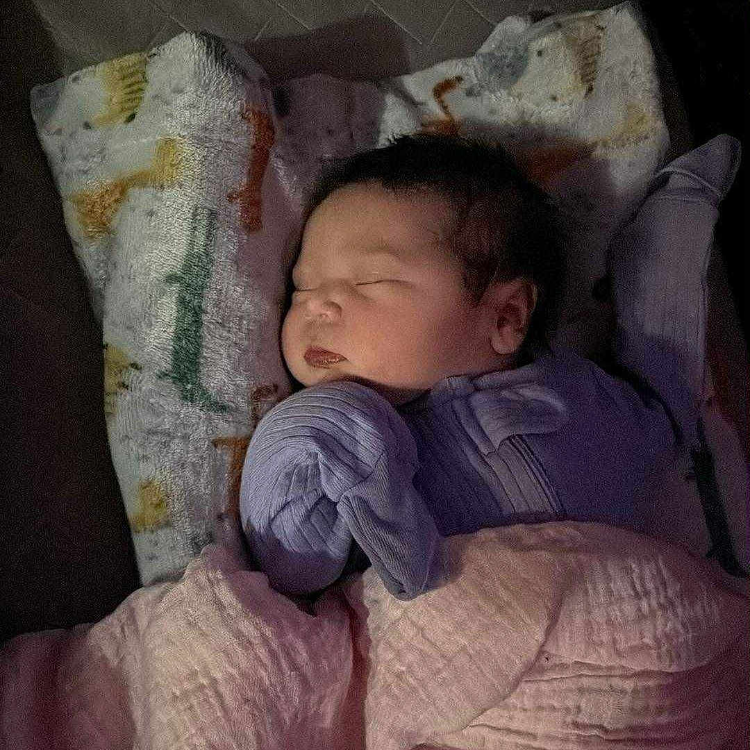 Vida is registered to the contest to win money with this photo: baby, bedtime, blanket, child, clothing, cozy, cute, face, indoors, infant, newborn, peaceful, pillow, portrait, quiet, resting, sleeping, soft, toddler, warm