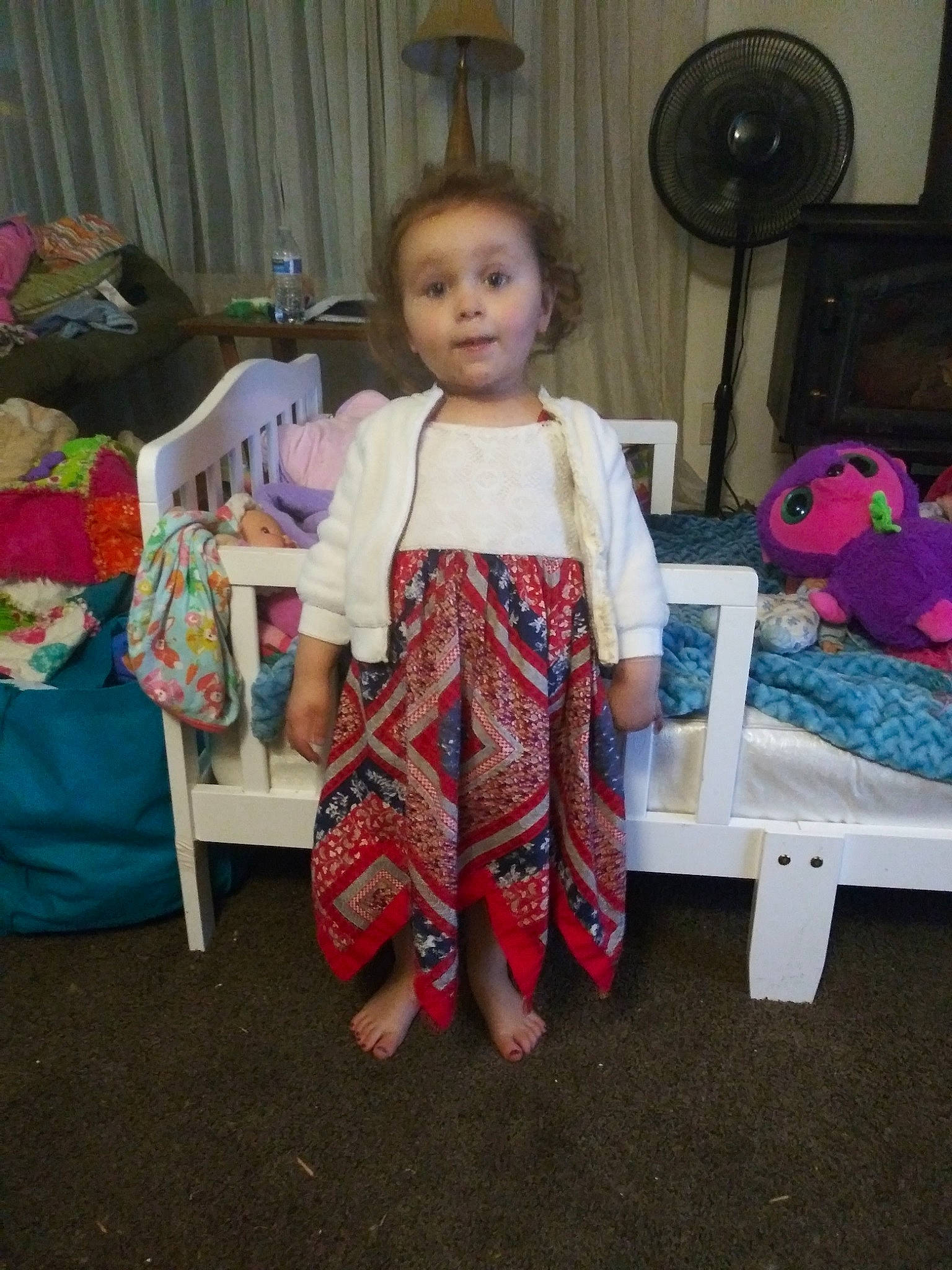 Lillian is registered to the contest to win money with this photo: baby, baby_toddler_clothing, child, curtain, event, fun, holiday, magenta, nightwear, pajamas, pattern, person, pink, play, room, sitting, surprise, t_shirt, textile, toddler