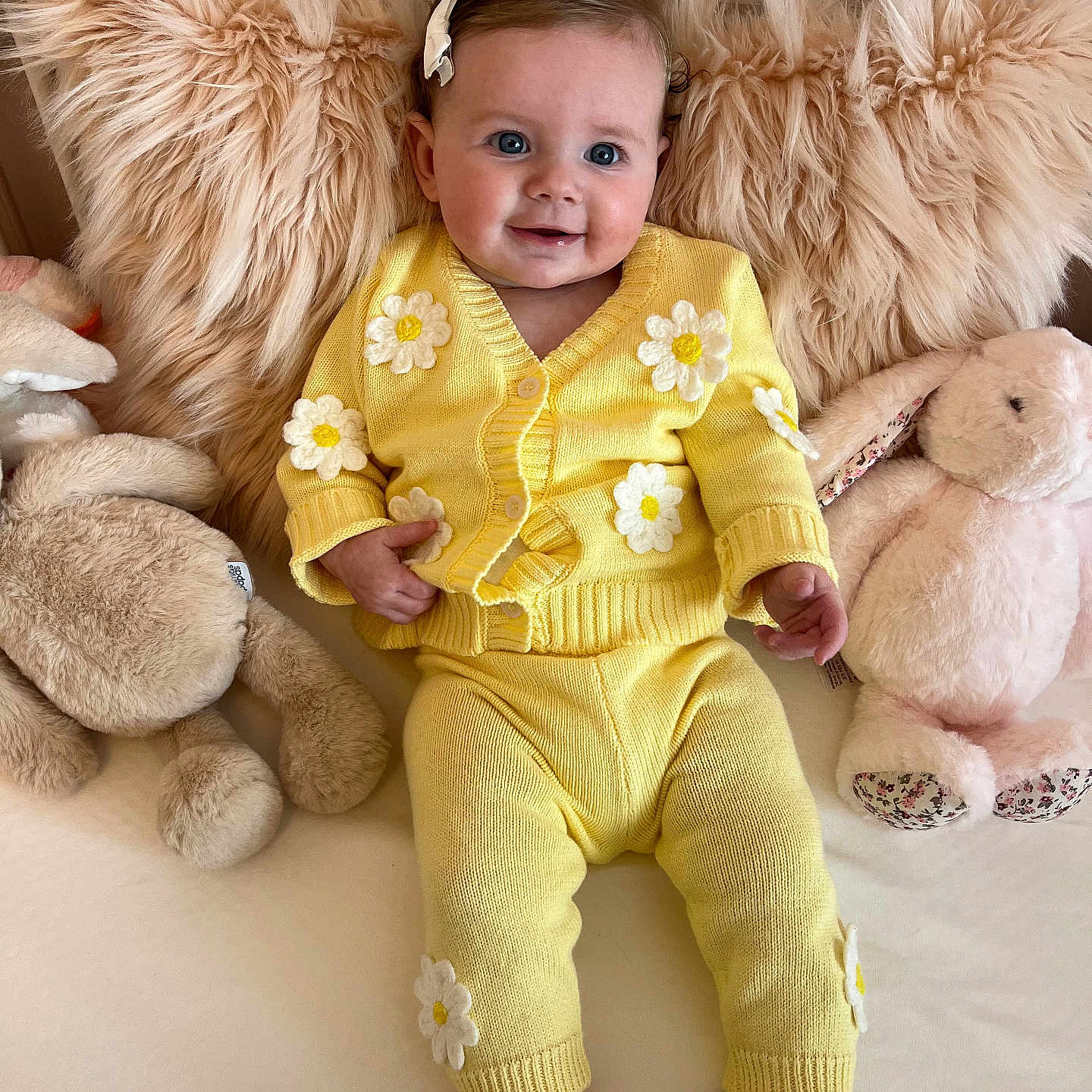 Isabella is registered to the contest to win money with this photo: baby, bodypart, clothing, costume, couch, cushion, face, finger, furniture, hand, happy, head, homedecor, pants, person, photography, portrait, sitting, smile, toy