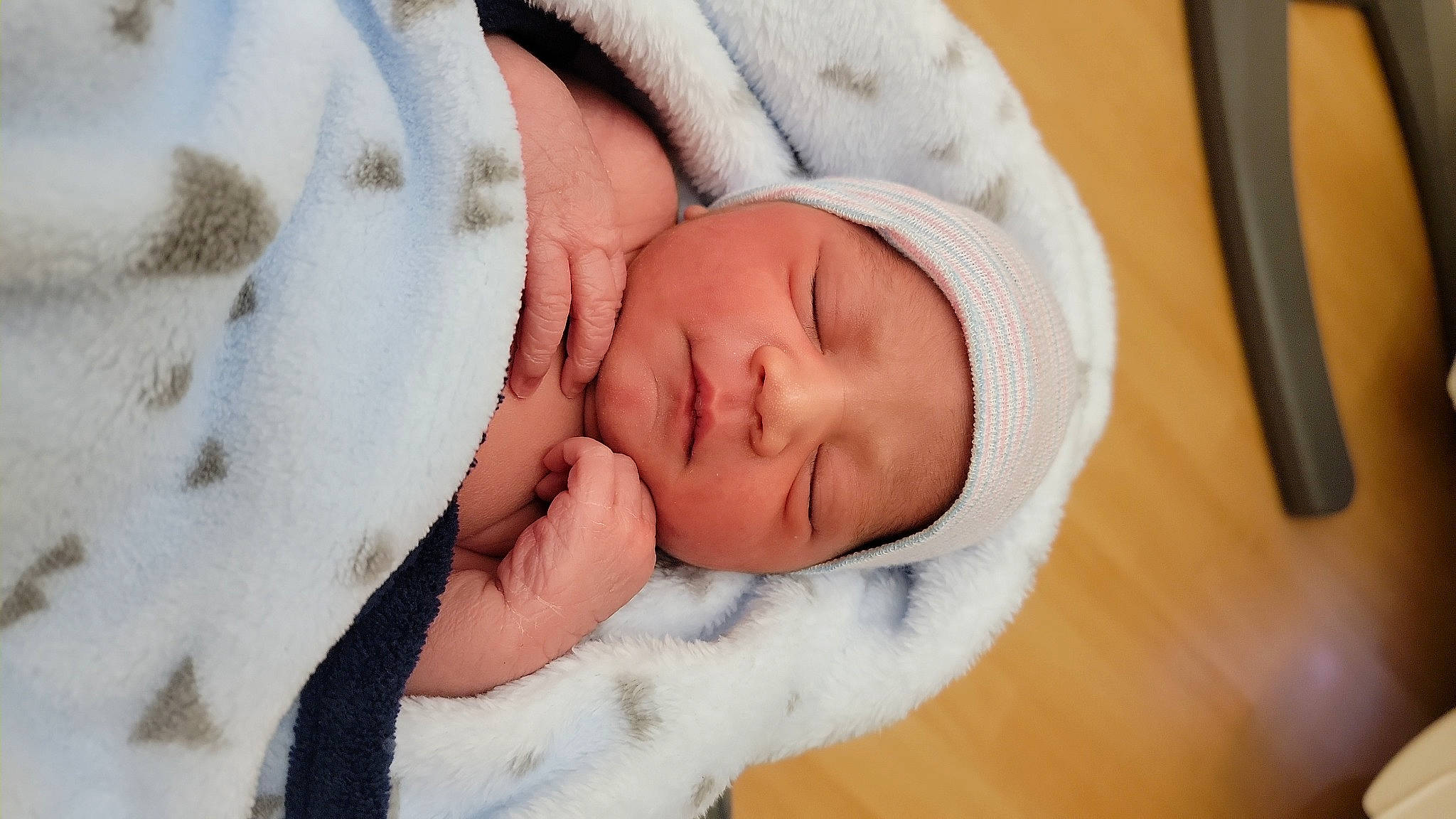 Remixai is registered to the contest to win money with this photo: baby, baby_products, baby_sleeping, baby_toddler_clothing, cap, cheek, child, comfort, eye, eyebrow, eyelash, finger, gesture, headgear, headwear, iris, linens, lip, nose, person