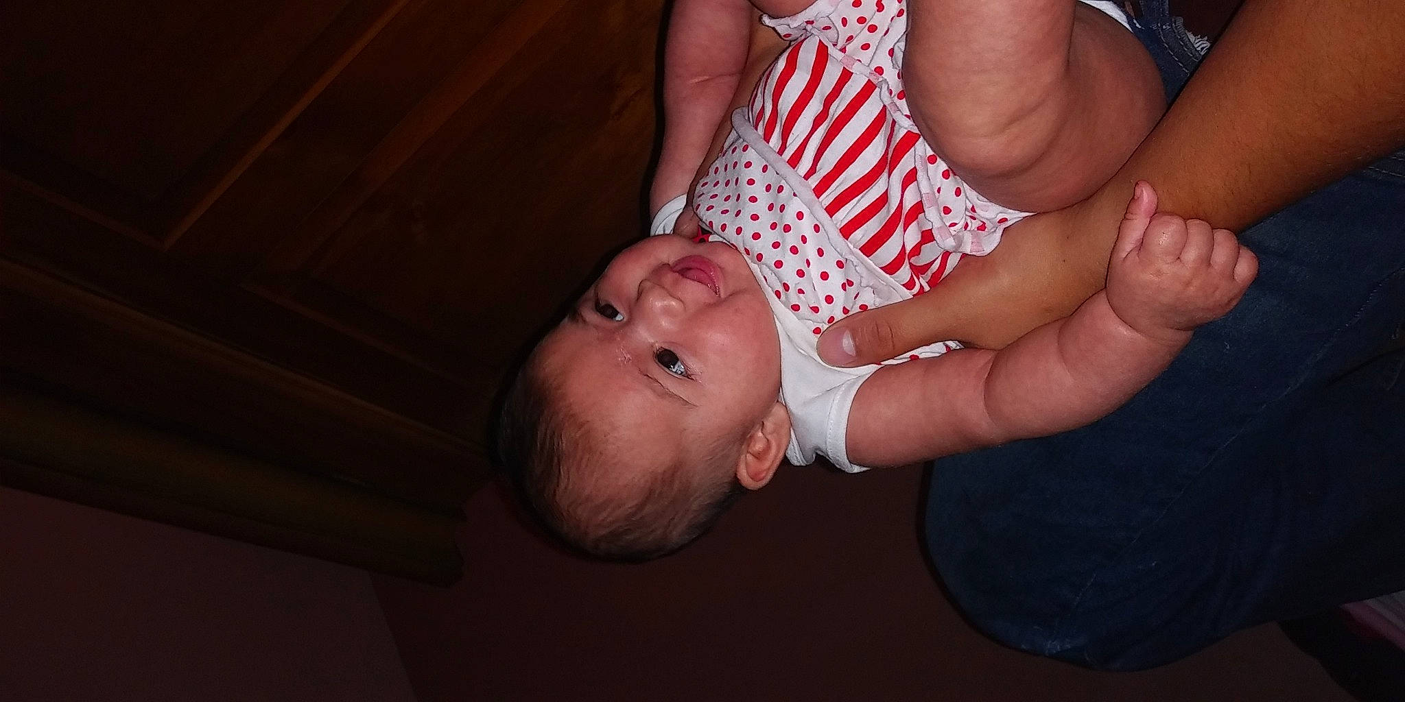 Azalea is registered to the contest to win money with this photo: arm, baby, baby_toddler_clothing, cheek, child, finger, flash_photography, gesture, hand, happy, human_leg, nail, nose, person, skin, thigh, thumb, toddler, trunk, wood