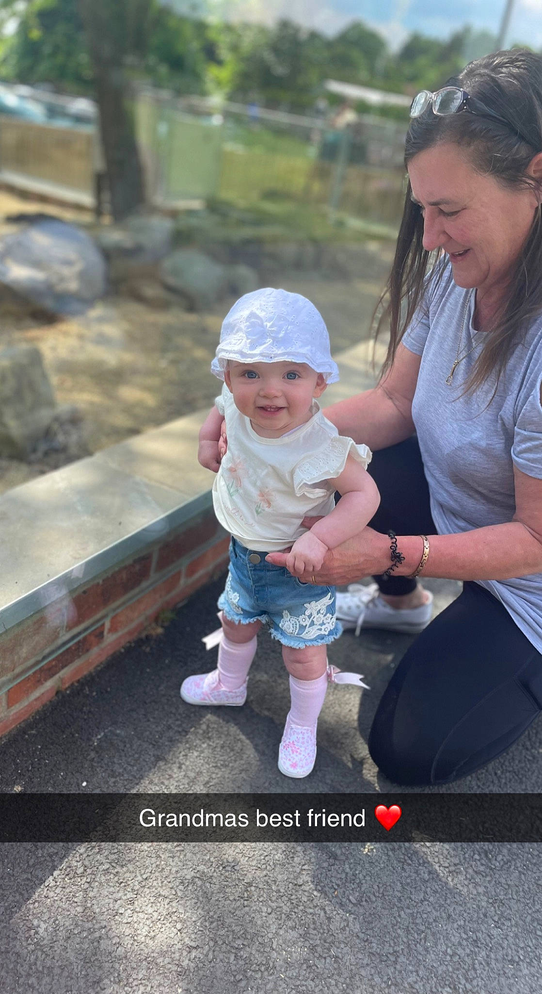 Freya joined the competition — help win amazing prizes! baby, baby_products, baby_toddler_clothing, child, eyewear, face, fun, grass, happy, hat, head, headwear, jewellery, joy, leisure, person, pink, recreation, sitting, smile