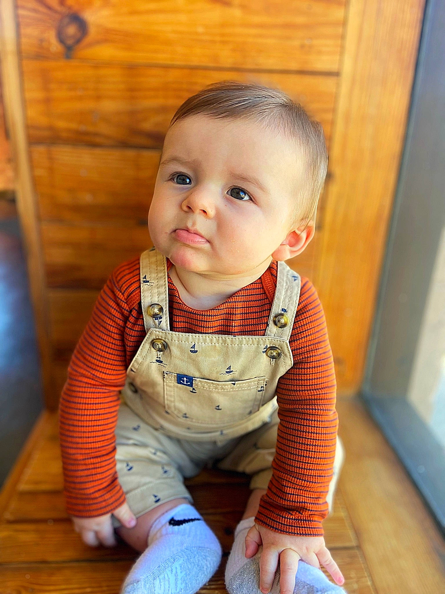 Tyton is registered to the contest to win money with this photo: baby, baby_toddler_clothing, cheek, collar, dress, eyebrow, floor, flooring, happy, hardwood, head, iris, lip, neck, nose, person, skin, sleeve, standing, toddler