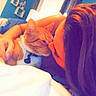 Simba is registered to the contest to win money with this photo: affection, bed, bedroom, blanket, blue_wall, casual, cat, collar, comfort, curtains, furniture, hair, human_hand, indoor, intimacy, nuzzle, orange_tabby, person, relaxation, window