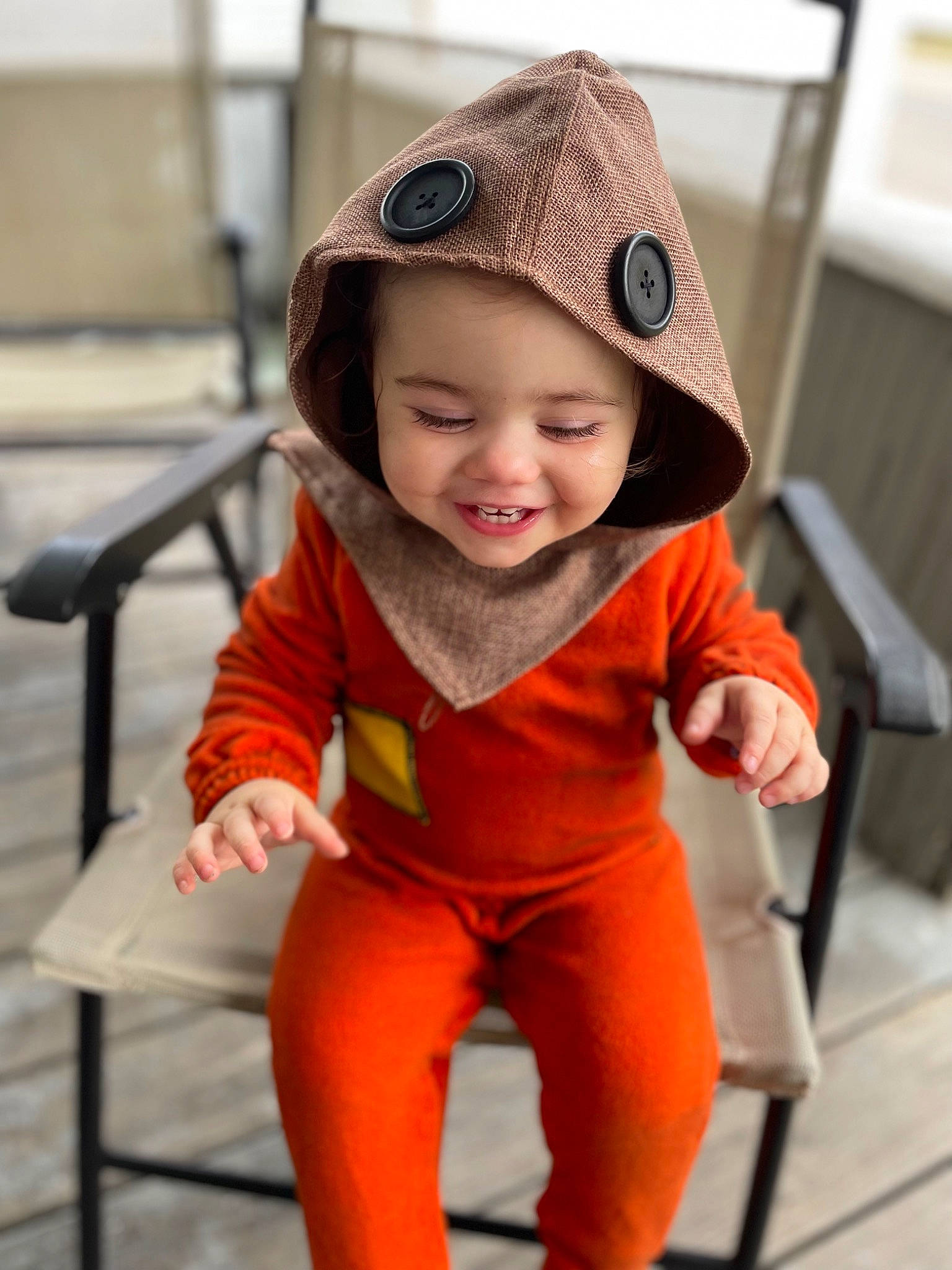 Scarlet is registered to the contest to win money with this photo: active_pants, baby, baby_toddler_clothing, cap, child, face, fashion_accessory, happy, hat, headwear, joy, orange, peach, person, personal_protective_equipment, portrait_photography, recreation, sleeve, smile, toddler