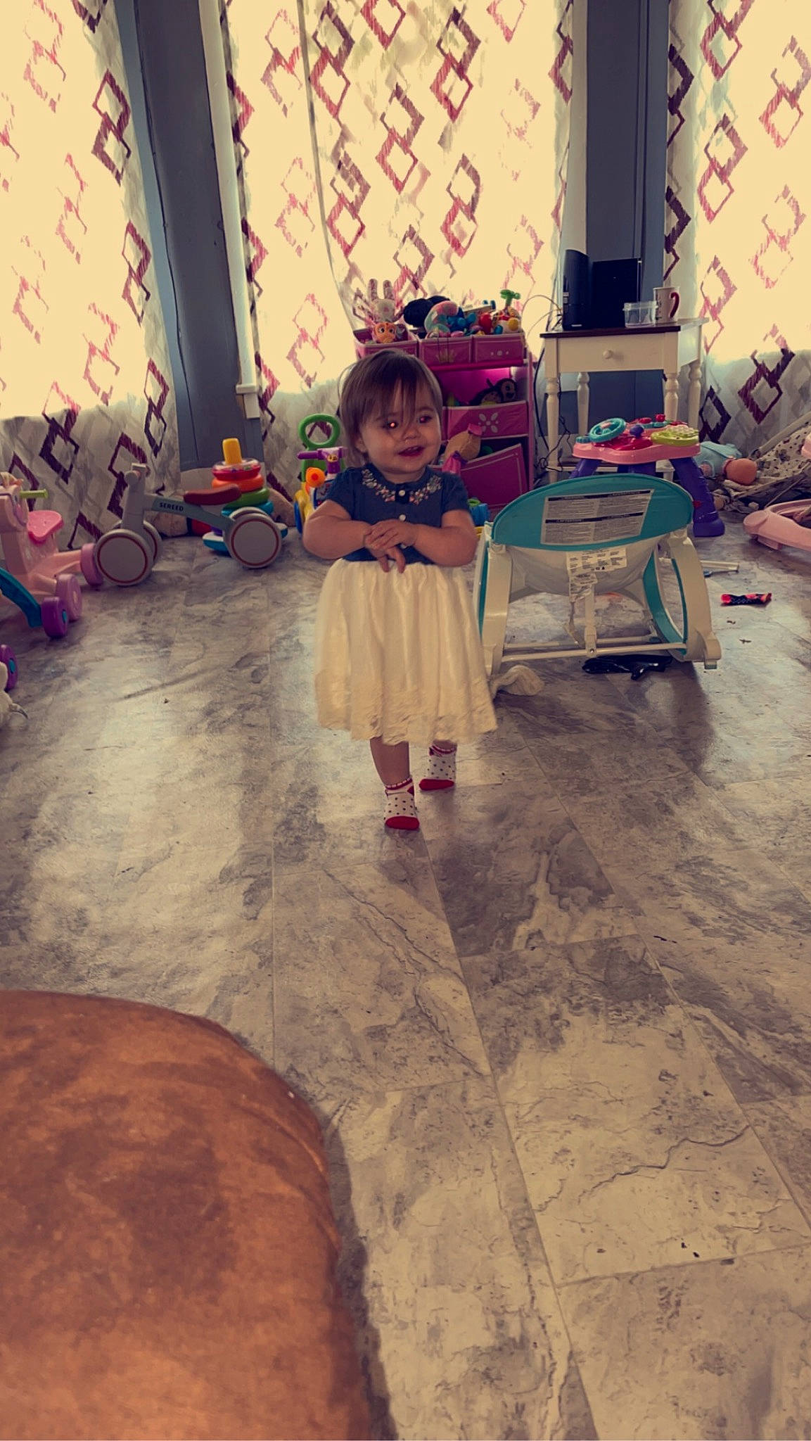 Scarlet is registered to the contest to win money with this photo: beauty, child, event, floor, flooring, fun, hardwood, interior_design, leisure, living_room, mammal, person, plant, room, sitting, textile, tints_and_shades, toddler, visual_arts, wood