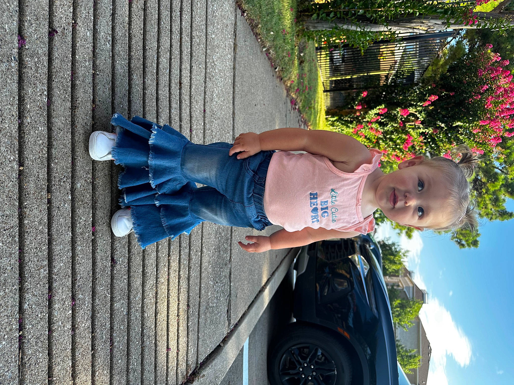 Anelise joined the competition — help win amazing prizes! automotive_exterior, automotive_lighting, automotive_tire, car, electric_blue, family_car, flower, fun, hat, hood, leisure, motor_vehicle, person, plant, sky, t_shirt, tire, toddler, tree, vehicle_door